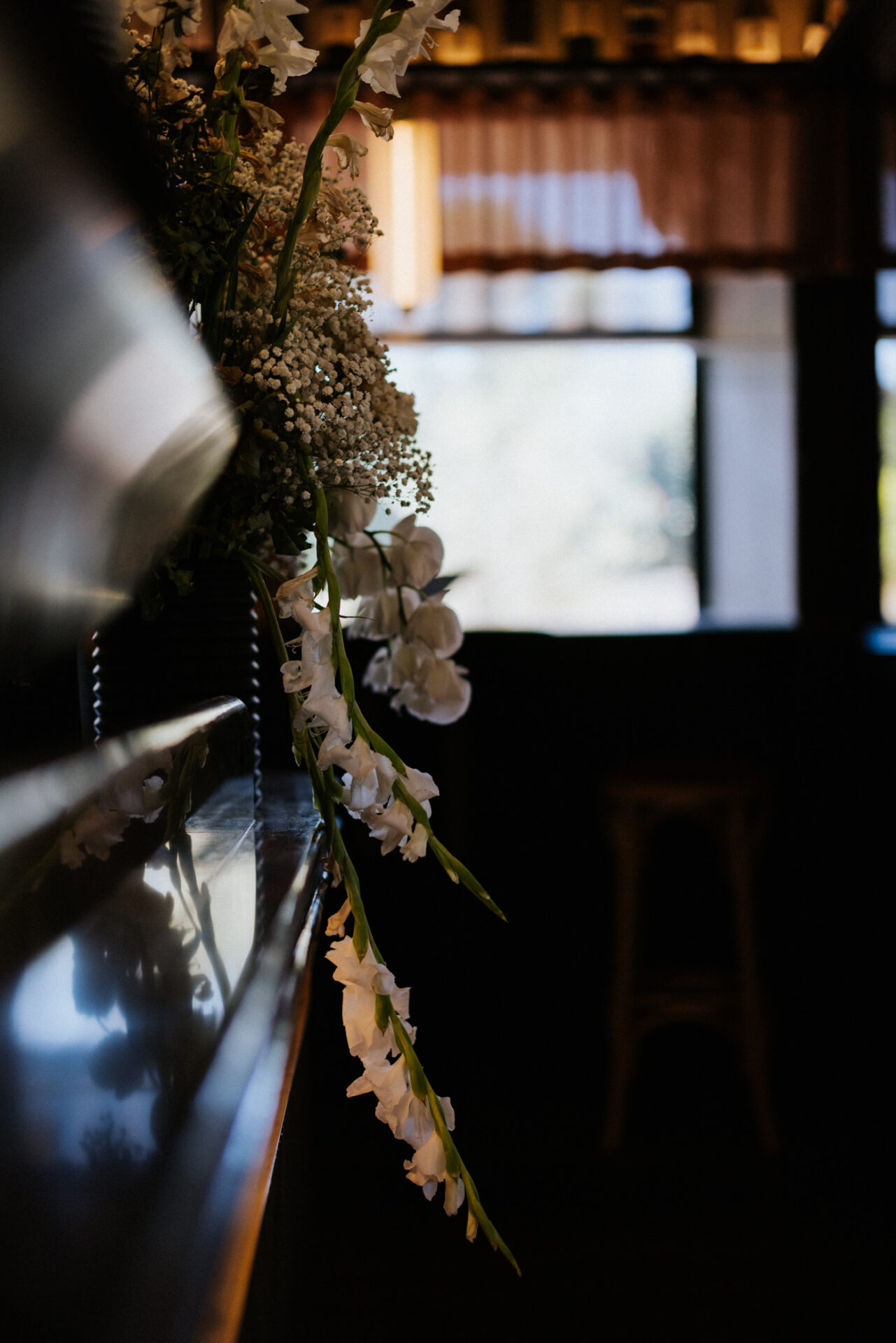 Artistic shot of flower arrangement hanging at Bar Vino.