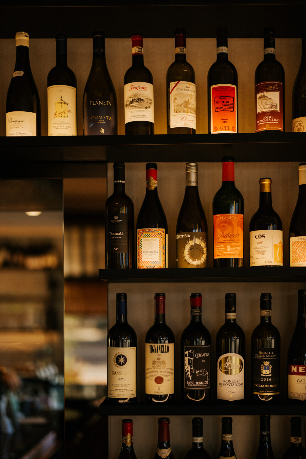 A selection of red wine bottles on display at Bar Vino Mount Lawley.