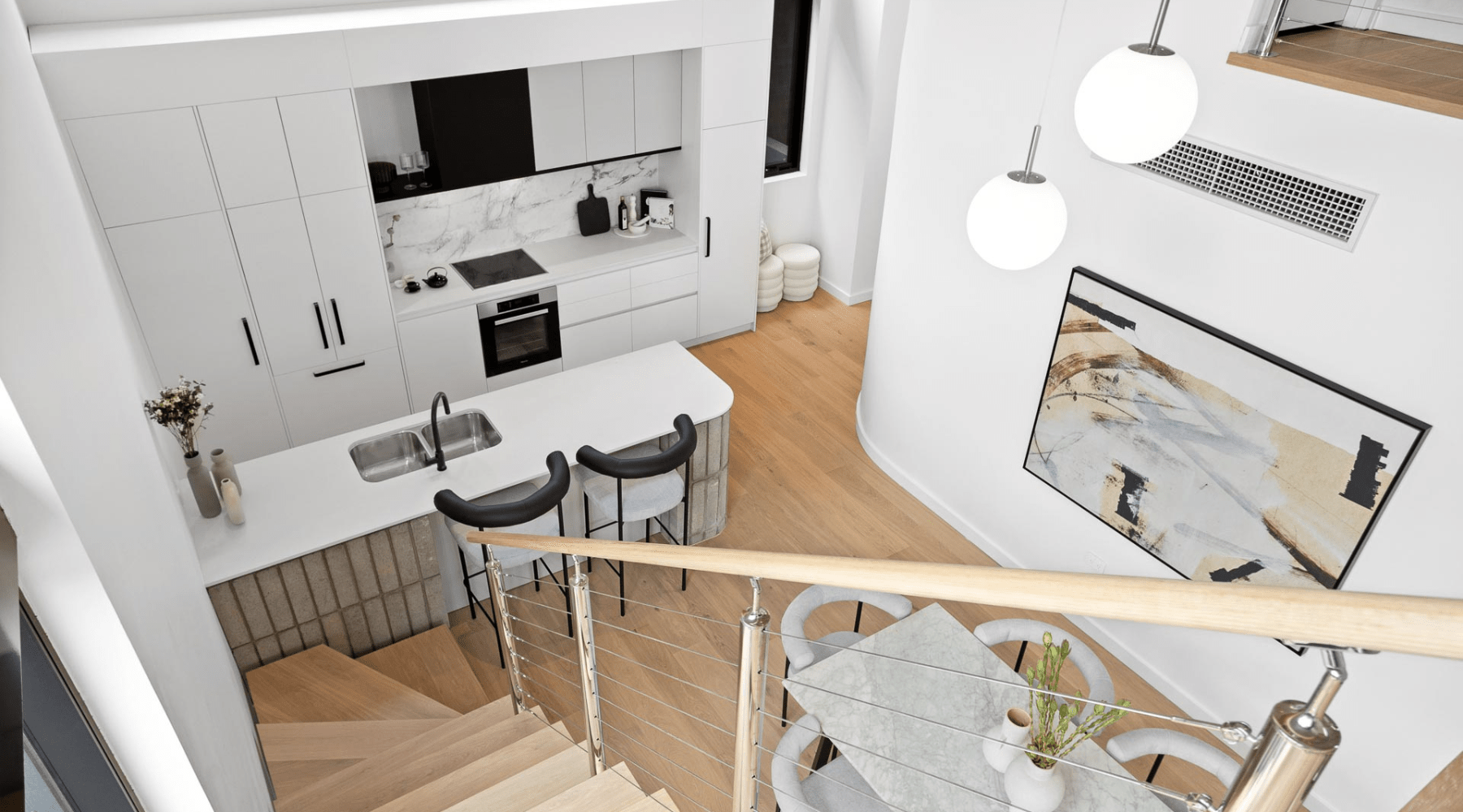 Looking down a set of stairs towards the kitchen and dining areas of Clifton & Central - Mt Lawley