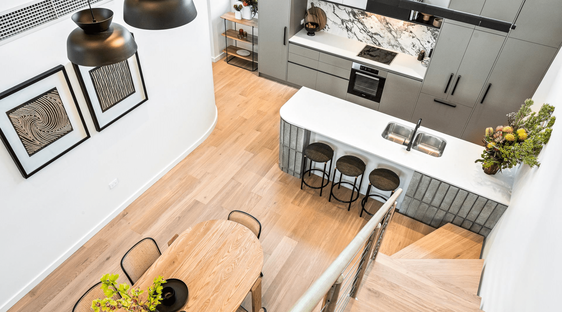 Looking down a set of stairs towards the kitchen and dining areas of Clifton & Central - Mt Lawley