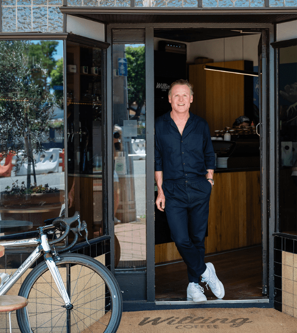 Tim Willing in doorway of Willing Coffee