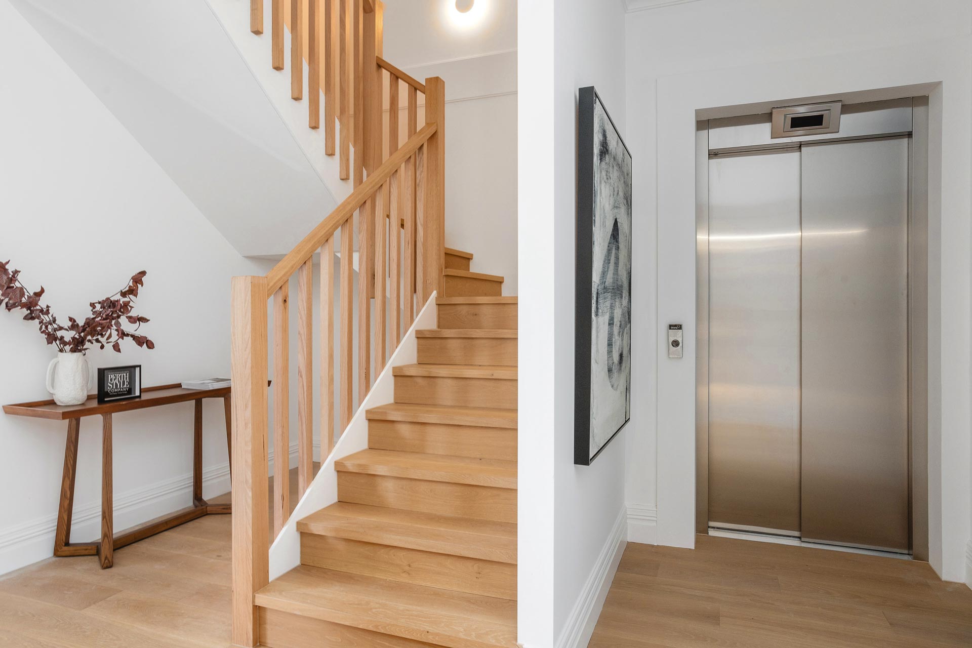 Elevator and central staircase at a No. 29 Field Street Townhouse in Mount Lawley