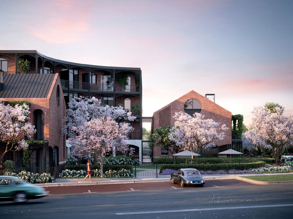 View of apartment and garden exterior from across the street showing the road and car parked in car bays