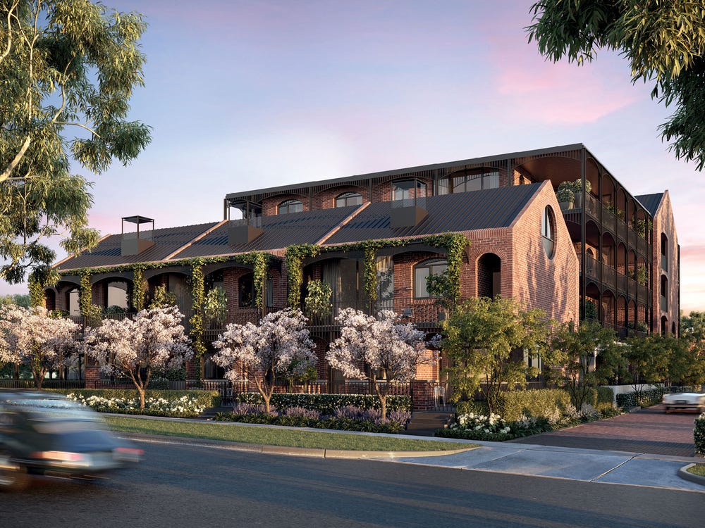 View of multi storey apartment building, Clifton & Central from across the street, building surrounded by lush gardens